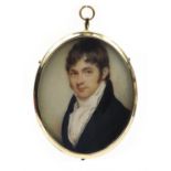 19th century oval portrait miniature of a gentleman wearing a black coat onto ivory, housed in a