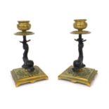 Pair of gilt brass candlesticks with dolphin supports, each 14.5cm high :To Request a Condition