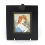 19th century rectangular portrait miniature of a red headed girl holding a flower and wearing a blue