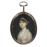 19th century oval portrait miniature of a lady wearing a white dress, housed in an unmarked gold