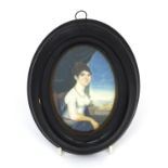 19th century oval portrait miniature of a seated female wearing a white dress onto ivory, housed