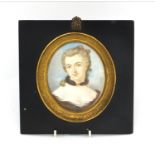 19th century oval portrait miniature of a lady onto ivory, signed Fiocchi, housed in an ebonised