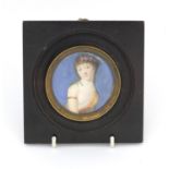 19th century circular portrait miniature of a semi clad female, housed in an ebonised frame, 6.5cm