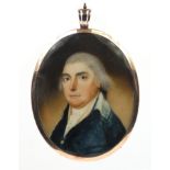 19th century oval portrait miniature of a gentleman wearing a blue coat onto ivory, housed in an