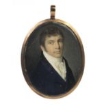 19th century oval portrait miniature of a gentleman wearing a blue coat onto ivory, possibly