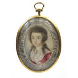 19th century oval portrait miniature of a lady wearing a red dress, housed in gold coloured metal