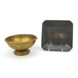 Brass footed bowl together with a square pewter dish inlaid with a mythical bird, both with