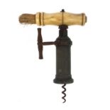 19th century brass corkscrew with bone handle, cast iron ratchet sidearm and side brush, 19cm when