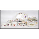 A Royal Worcester  Evesham pattern dinner service complete with plates, tureens etc.