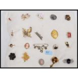 A collection of costume jewellery brooches to include cameo, celtic knot,