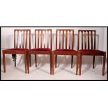 A set of 4 retro mid century Meredow dining chairs being raised on tapered supports with