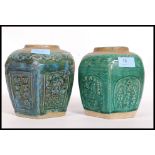 A pair of Chinese green glazed vases.