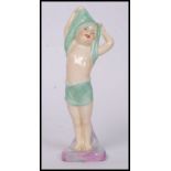 A Royal Doulton ceramic  figure entitled " To Bed " bearing model no HN1805 to the base- 16cm tall