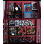 A collection of costume jewellery to include rings, bangles, necklaces, earrings etc,