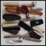 A collection of pen knives to include military model and several other designs