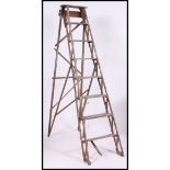 A vintage mid 20th century wooden step ladder.