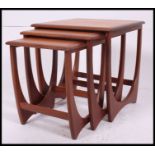 A G-Plan style Kelso nest of teak Danish tables. Each with shaped supports and graduating tops.