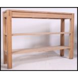 A good quality solid oak console table in the form of a workbench.