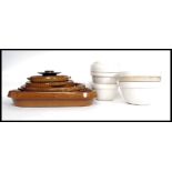 A collection of retro stoneware cooking pots along with a collection of ceramic cooking / pudding