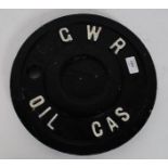 A GWR cast Iron cover for a fuel tap with the words GWR OIL GAS,