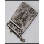 A charming small pewter aide de memoir notepad of elegant form, decorated with an owl to the front.