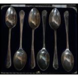 A cased set of six silver hallmarked teaspoons of golfing interest by Walker & Hall.