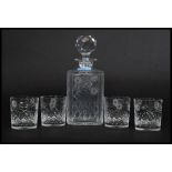 A good quality cut glass and etched decorated decanter together with 4 matching whisky tumblers