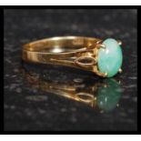 An 18ct gold and jade ladies ring.