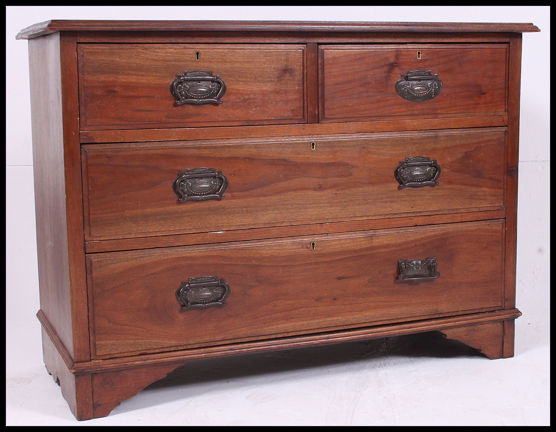 An Edwardian ash / oak wood 2 over 2 cottage chest of drawers.