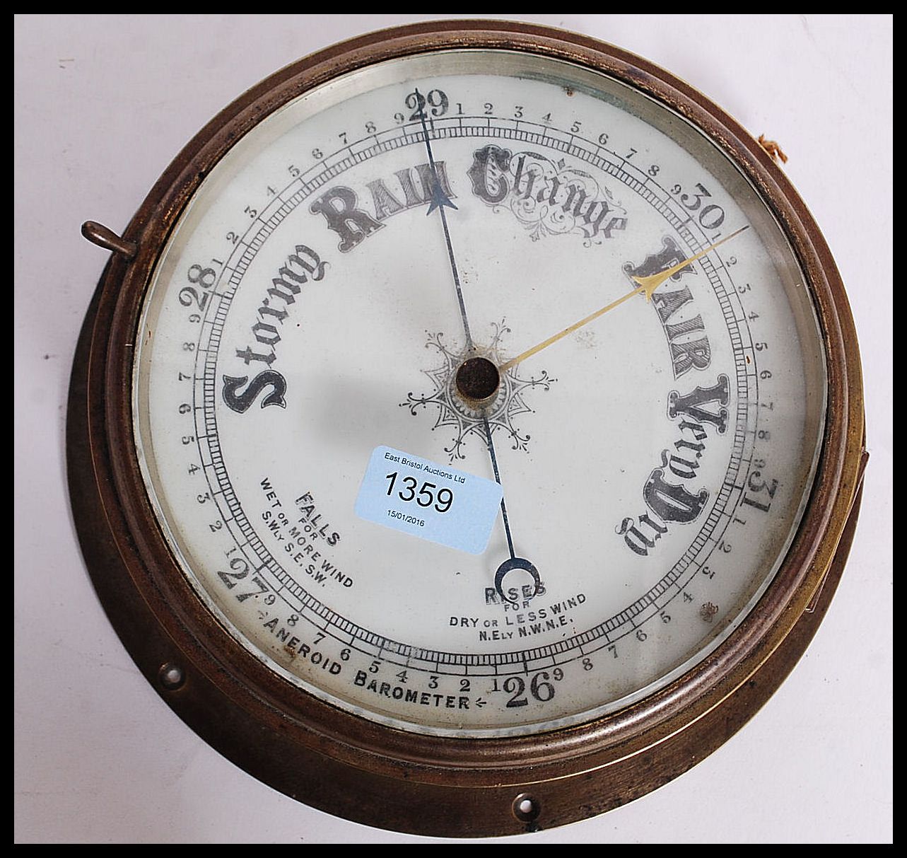 An early 20th century brass cased Bulkhead Aneroid Barometer,