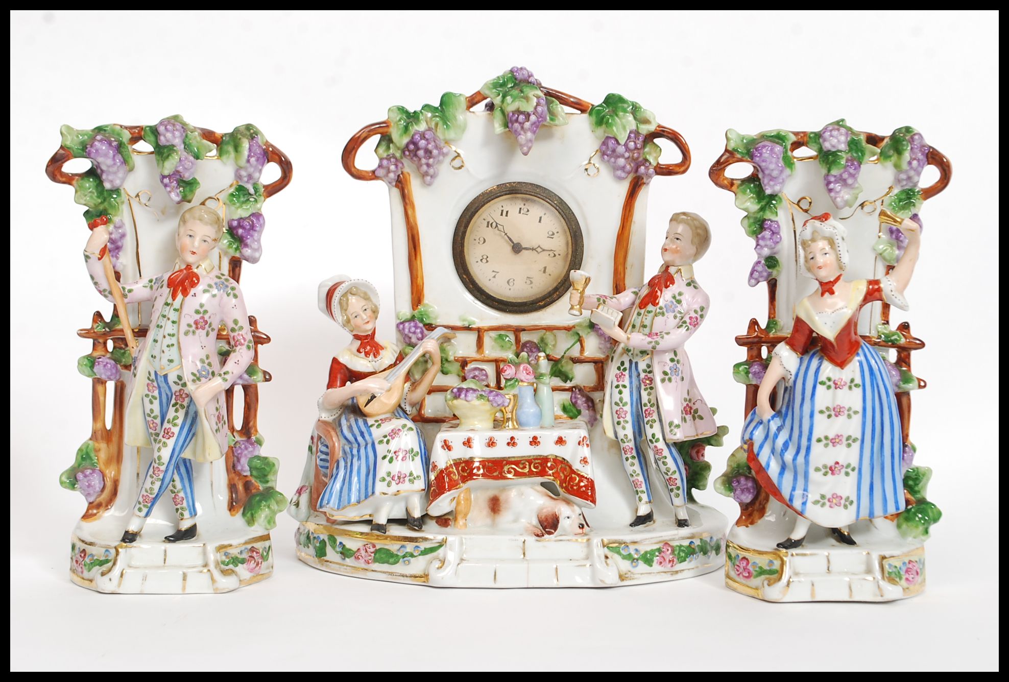 A 20th century Dresden style continental ceramic clock and garniture set.