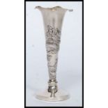 A 20th century white metal (does test as silver) unmarked Chinese oriental dragon vase,