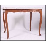 An early 20th century French provincial oak painted shabby chic draw leaf extending dining table.