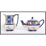 A Royal Winton Ivory Ware teapot complete with a matching jug. Both stamped to the base.