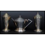 A 1930's Art Deco cased silver plated 3 piece cruet set compising condiments and conserve pot with