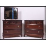 A Stag Minstrel three over two mahogany chest of drawers along with a matching dressing table chest