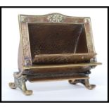 An unusual 20th century brass match striker in the form of a fire place marked for Cosmos Radiant