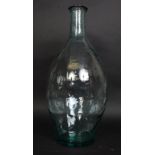 A large bulbous shaped clear glass continental olive jar bottle.