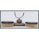 A Sterling silver 950 marked pair of clothes brushes together with a silver plate pen stand with