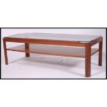 A retro 1970's teak and smoked glass rectangular coffee table.