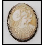 An excellent Edwardian silver ladies cameo with twin maidens to the agate stone centre with ribbed