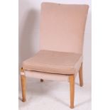 A vintage Parker Knoll upholstered bedroom chair together with a matching upholstered wingback