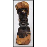 An African tribal of polished carved hardwood of a bearded tribesman.