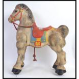 A vintage Mobo tinplate childs walking horse - with original Mobo label to front.