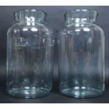 A pair of large continental glass pickle jars.