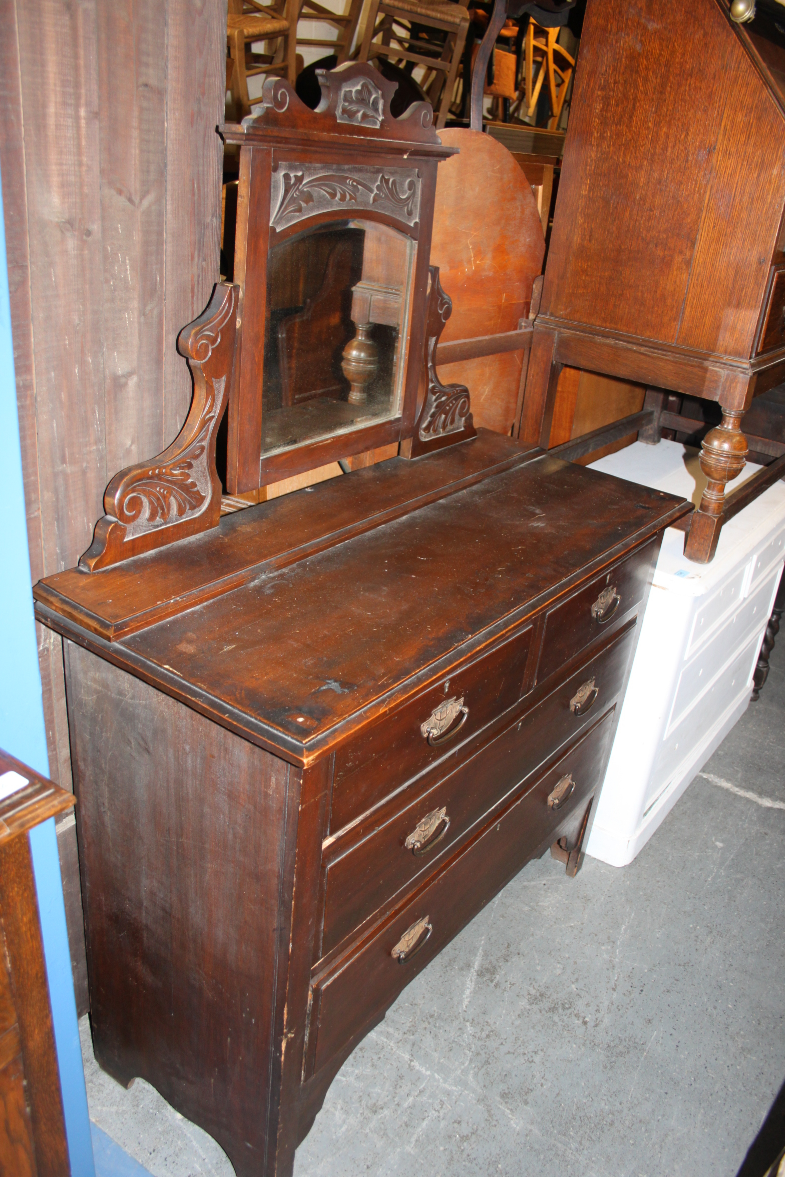 An Edwardian mahogany dressing table chest of drawers.