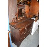 An Edwardian mahogany dressing table chest of drawers.