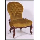 A Victorian mahogany spoon back ladies armchair / nursing chair.
