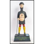 A reproduction metal Guinness advertising figure money box.