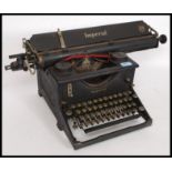 An early 20th century vintage manual typewriter by Imperial, having an A3 roller,